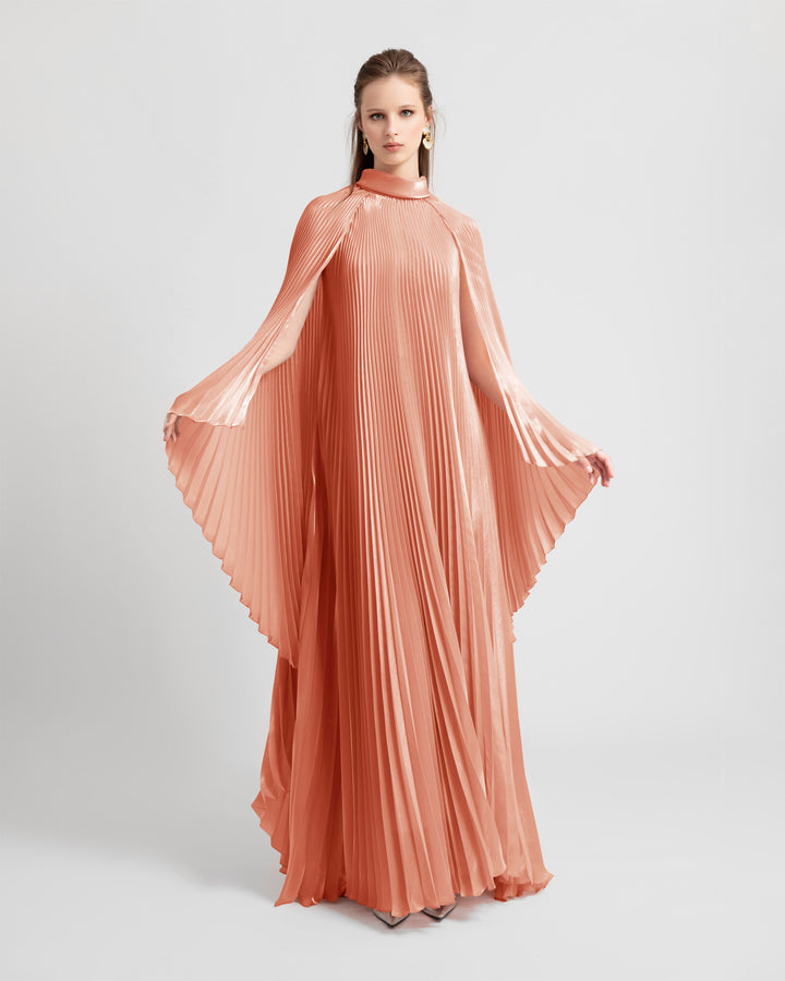 A fully pleated soft lame organza flared dress with cape-like sleeves.