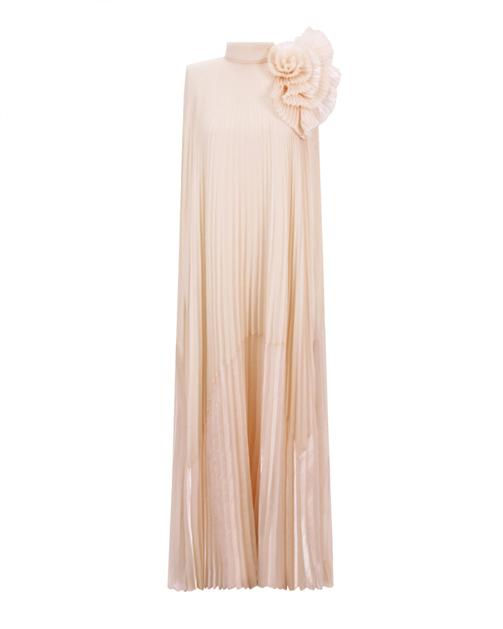 A fully pleated lame organza flared beige dress with an embellished draped flower on the shoulder.