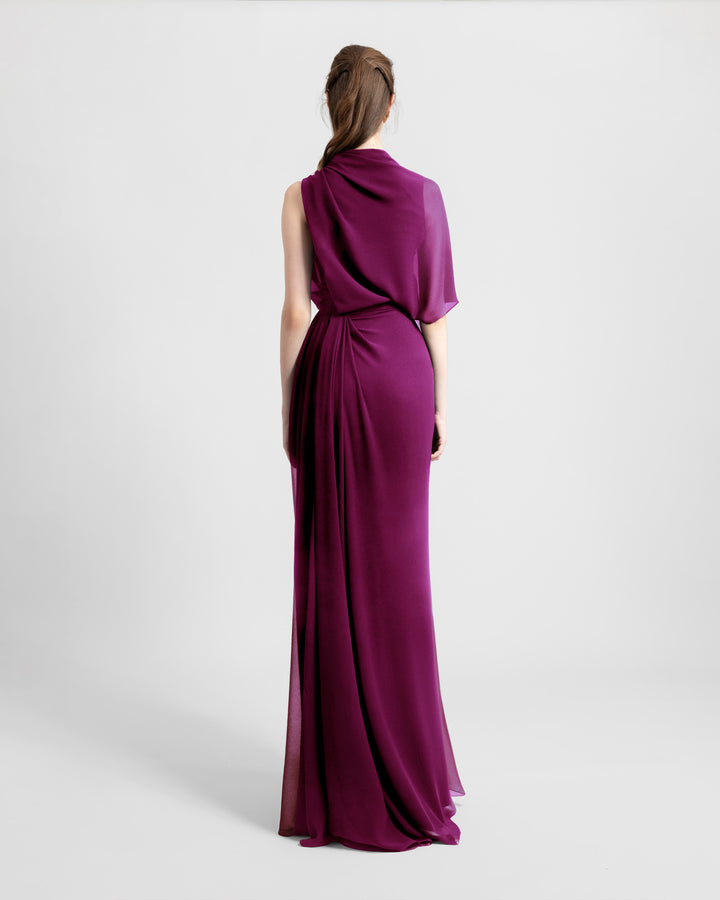 The back of an asymmetrical chiffon evening dress with draping details.