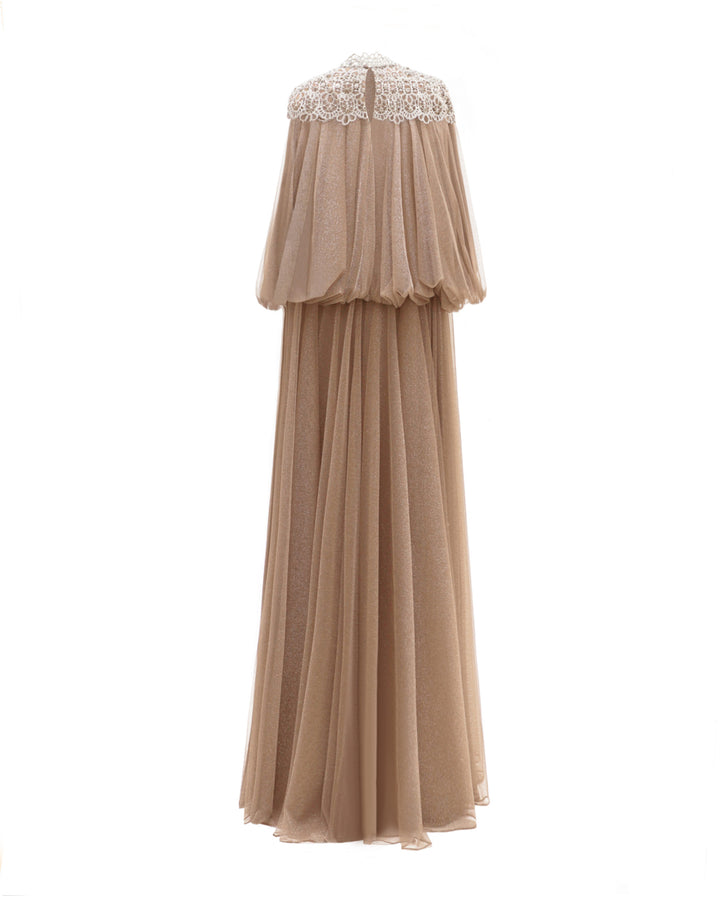 The back of a taupe color kaftan-style loose-cut tulle dress with lace at the neckline, gathered waist at the back, and three-quarter sleeves.