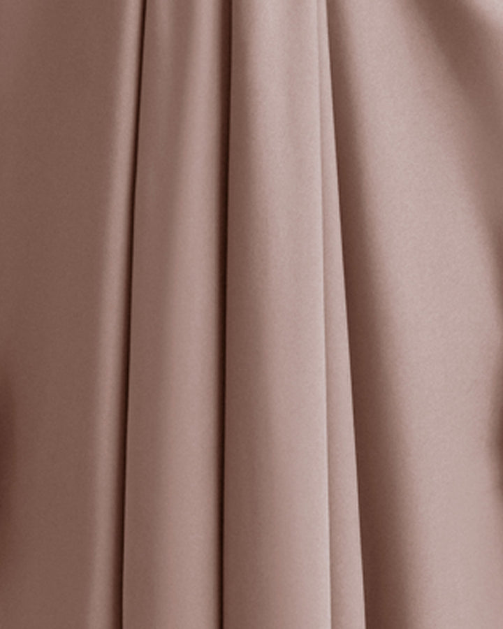 A close-up of a taupe color satin fabric.