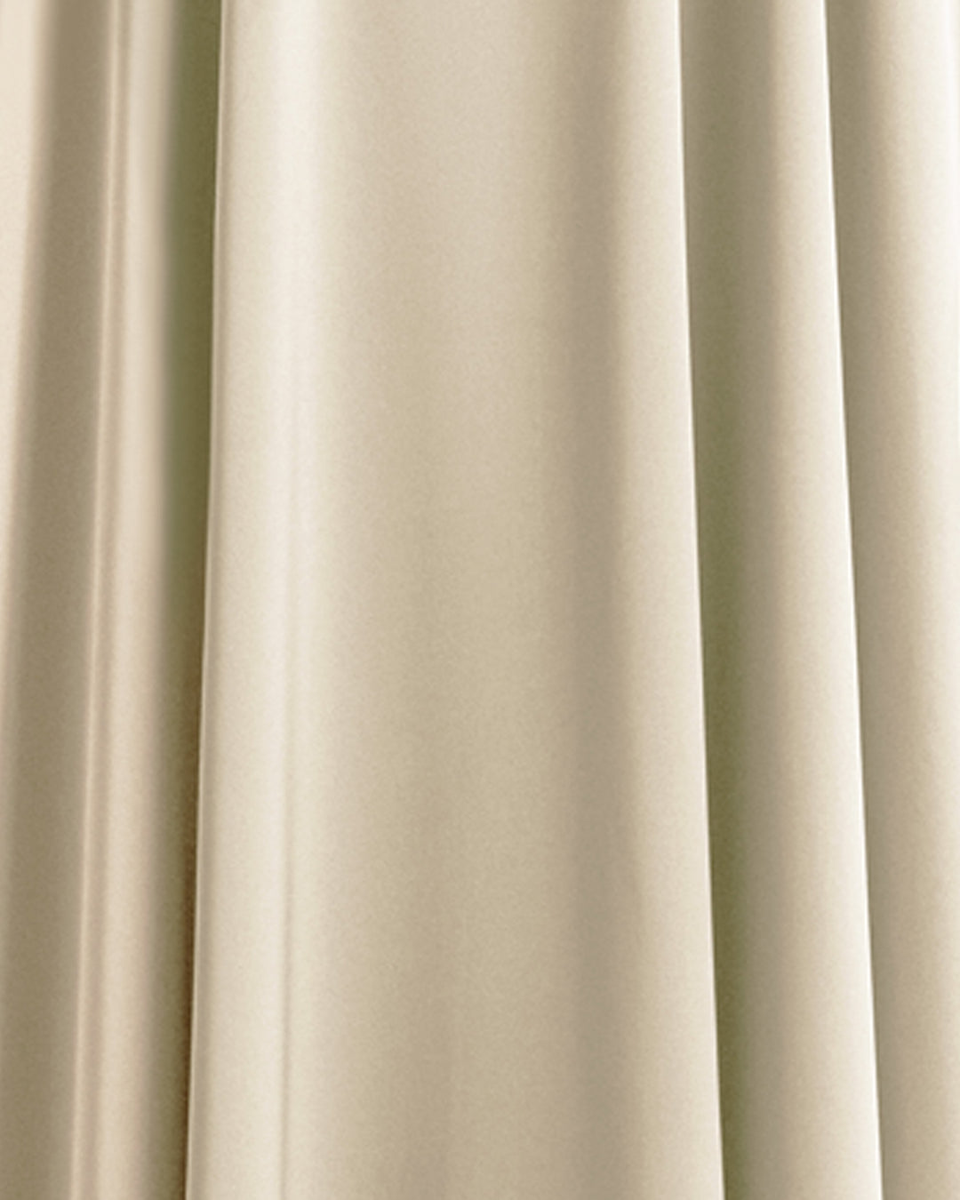 A close-up of a cream color satin fabric.