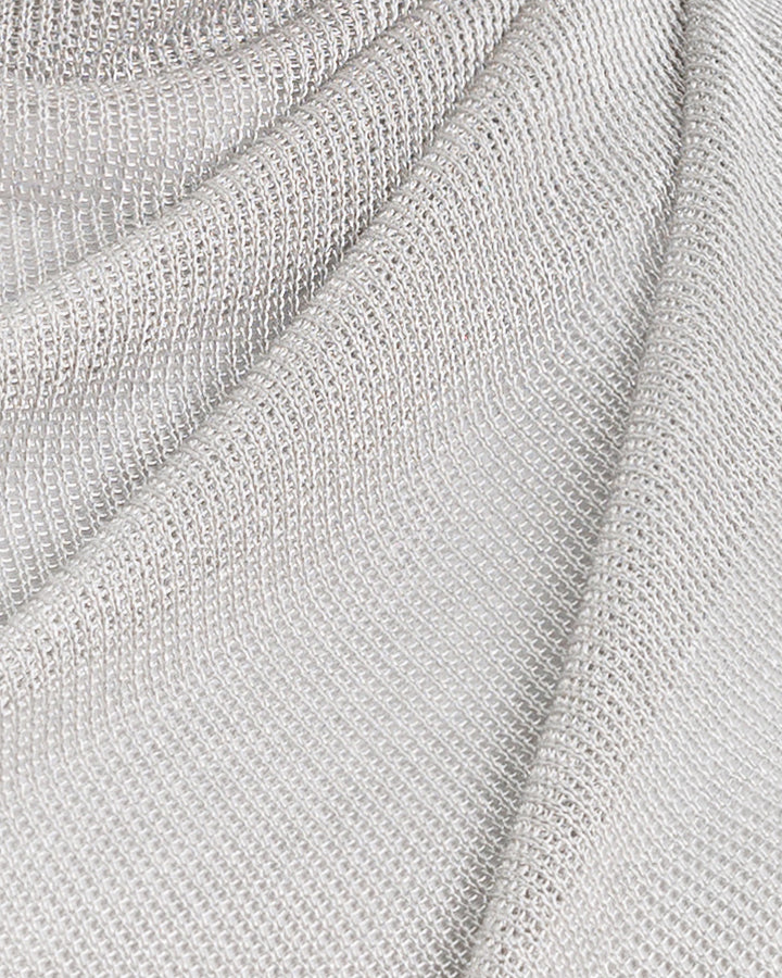 A close-up of a silver net tulle fabric.