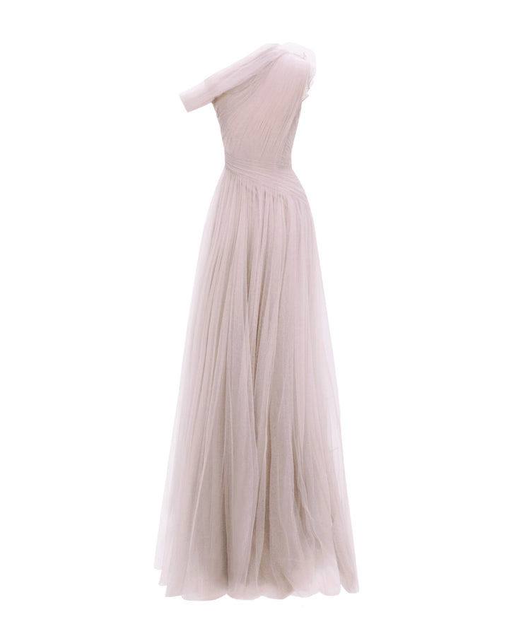 The back of a full tulle long evening lilac dress, with an asymmetrical neckline, and draping design on the bodice.