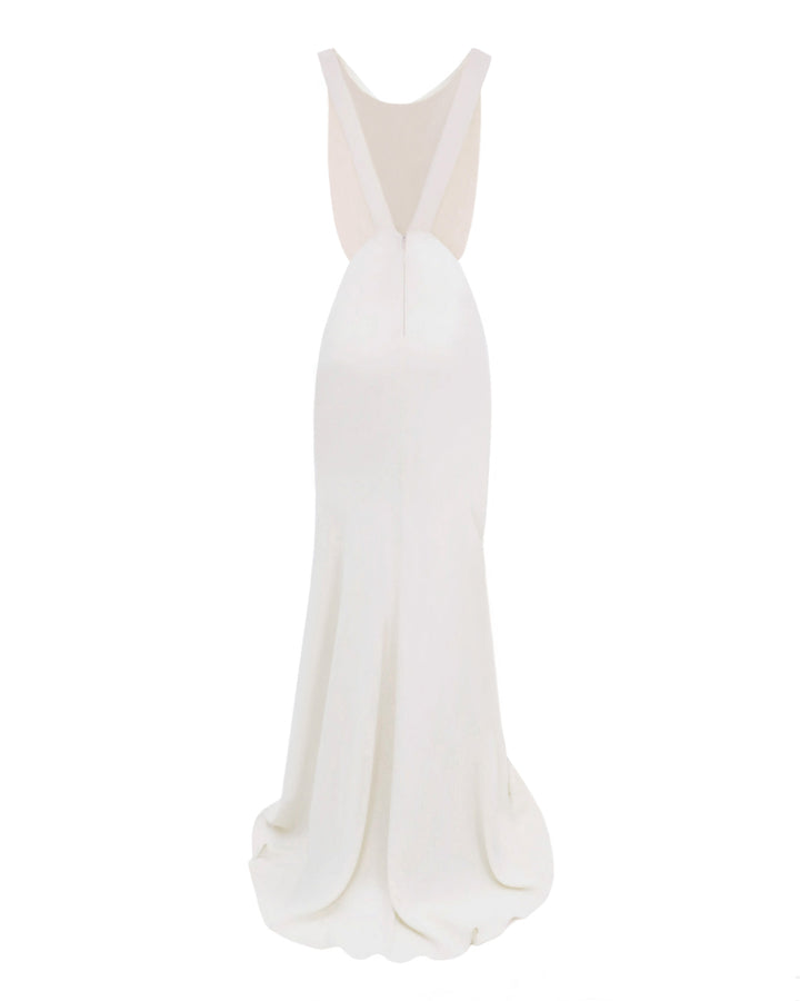 The back of a slim-cut cream evening dress featuring an alluring open back with V-shaped straps.