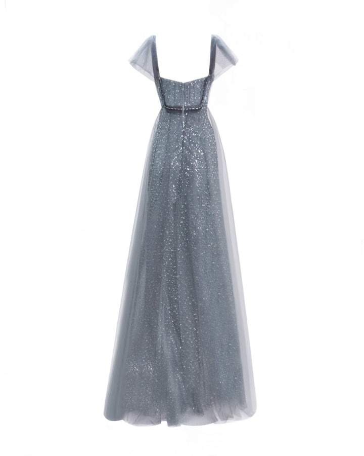 The back of a loose-cut grey dress with puffed tulle sleeves and a beaded underlayer.