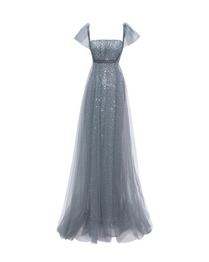 A loose-cut grey dress with puffed tulle sleeves and a beaded underlayer.