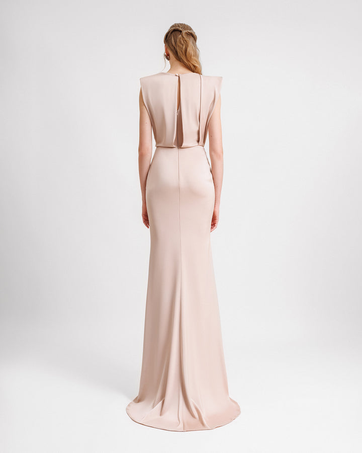 A blush color slim cut evening dress with a slightly open back.