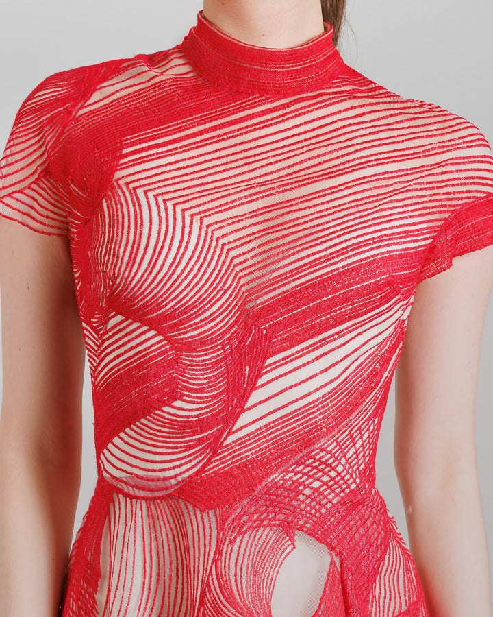 A close-up of a red flared evening dress with high-neck and short sleeves.