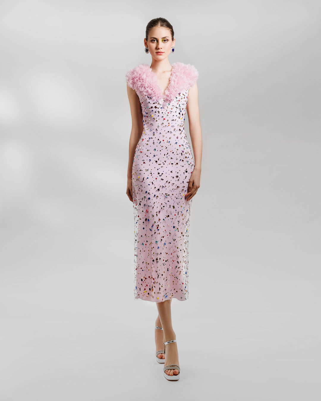 A fully multicolor beaded pink midi dress featuring a V- Neckline with rushed organza detail.