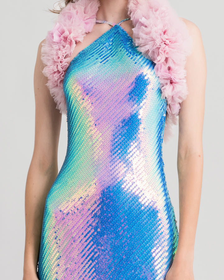 A close-up of an halter-neck slim-cut sequined blue evening dress, paired with a pink rushed tulle bolero.