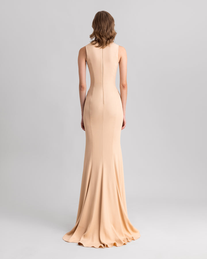 The back of a slim-cut crepe evening dress in beige color.