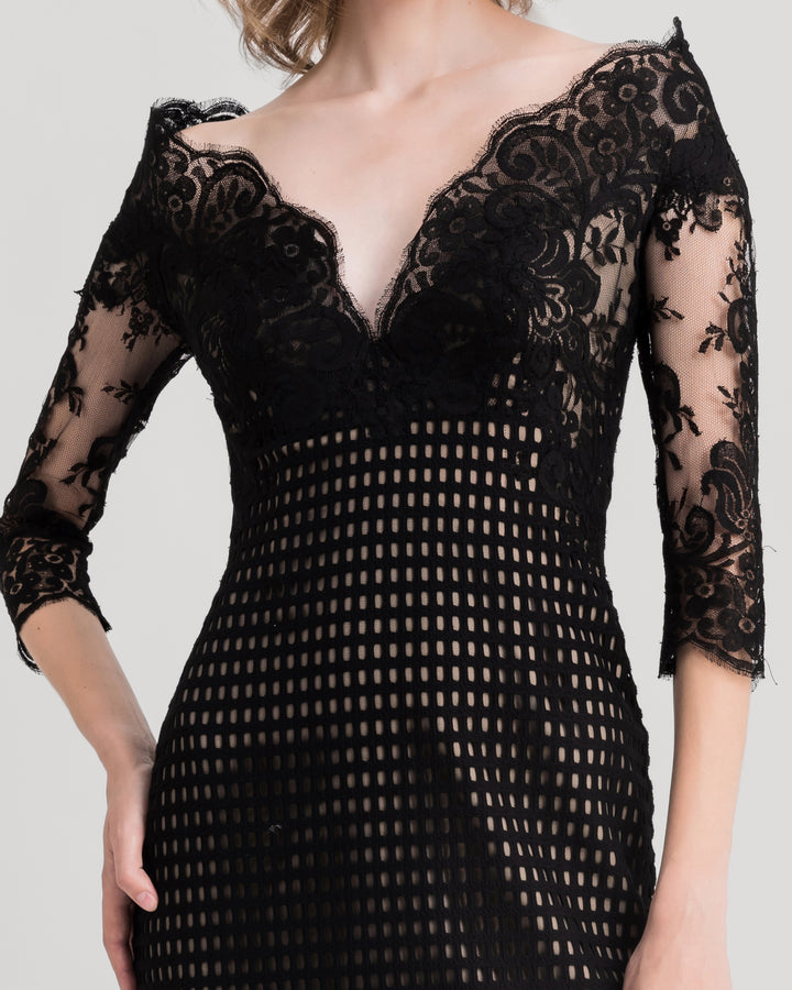 A close-up of an off-the-shoulders, V-neckline black crochet lace evening dress.