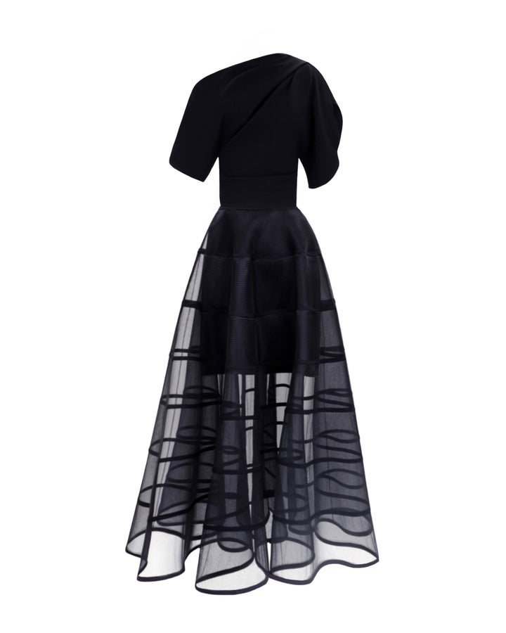 An evening wear set featuring an asymmetrical draped crepe black top with slit on the sleeves, matched with a cage-like skirt.