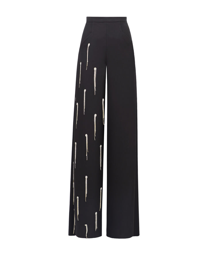 A straight-cut black pants featuring beading fringes on a single leg.