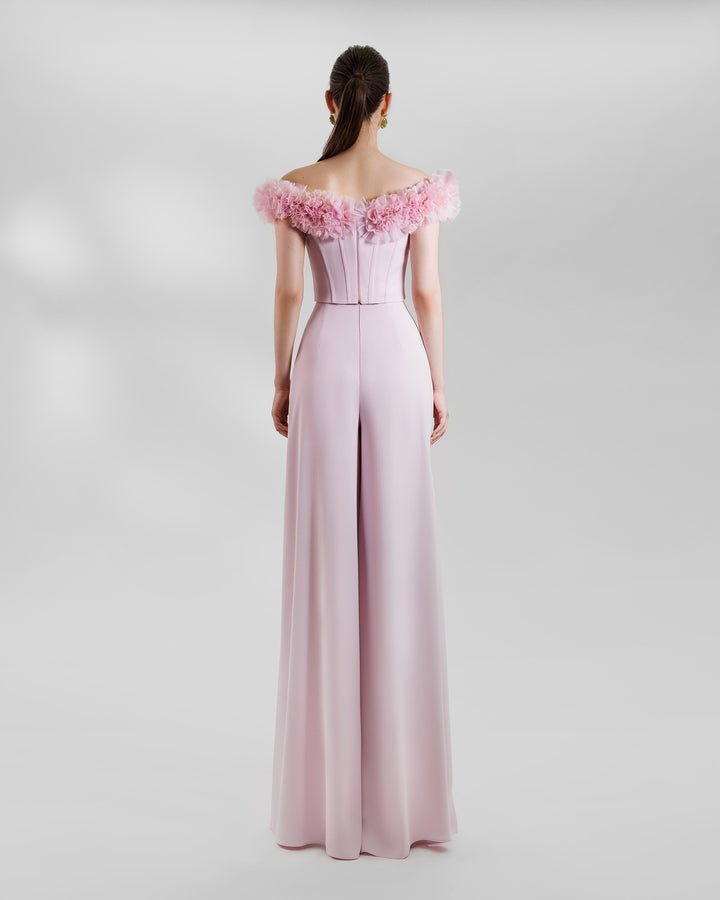 The back of an evening wear pink set featuring an Off-the-shoulders corset with rushed details on the neckline paired with wide high-waist pants.