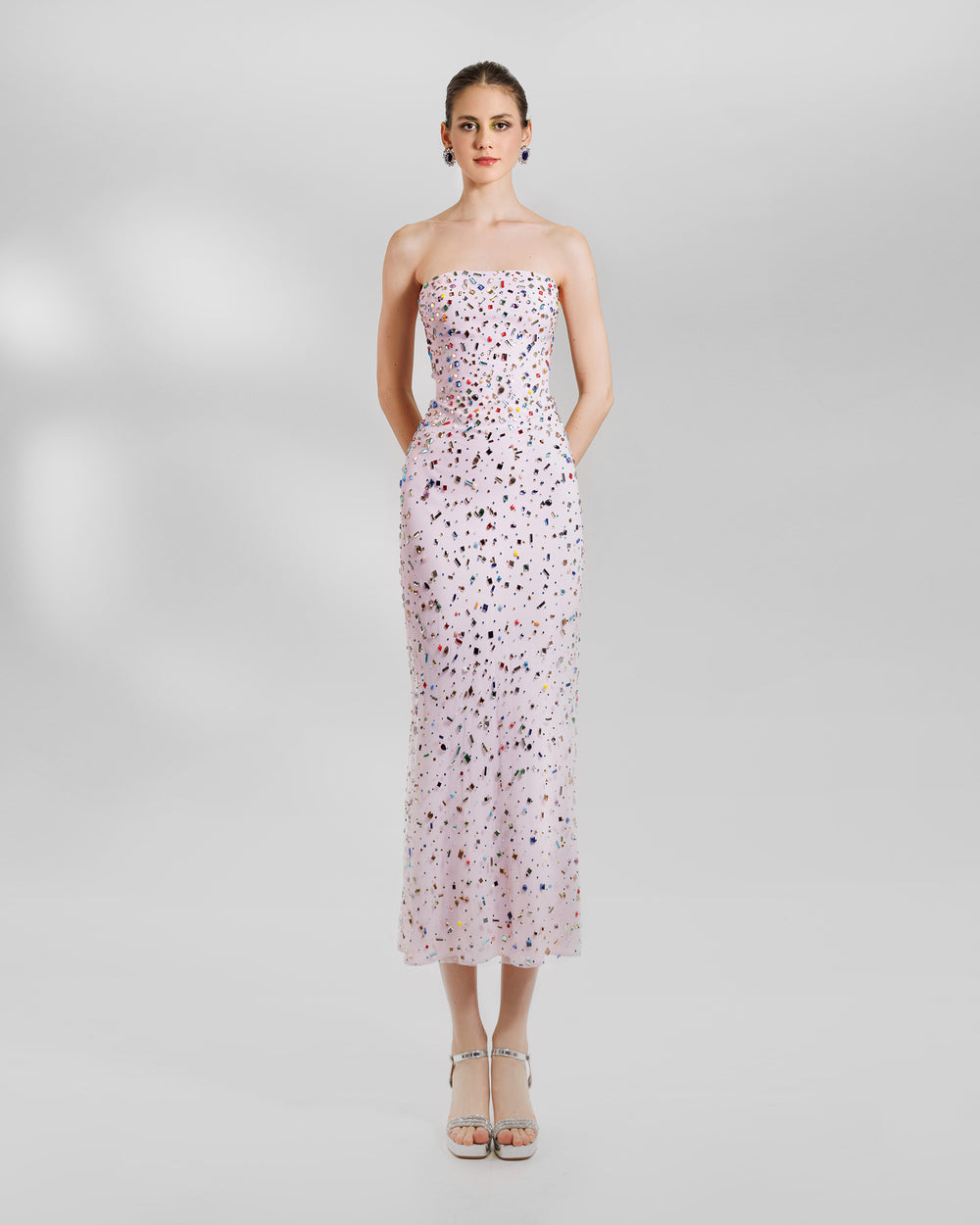 A strapless fully beaded pink midi evening dress.