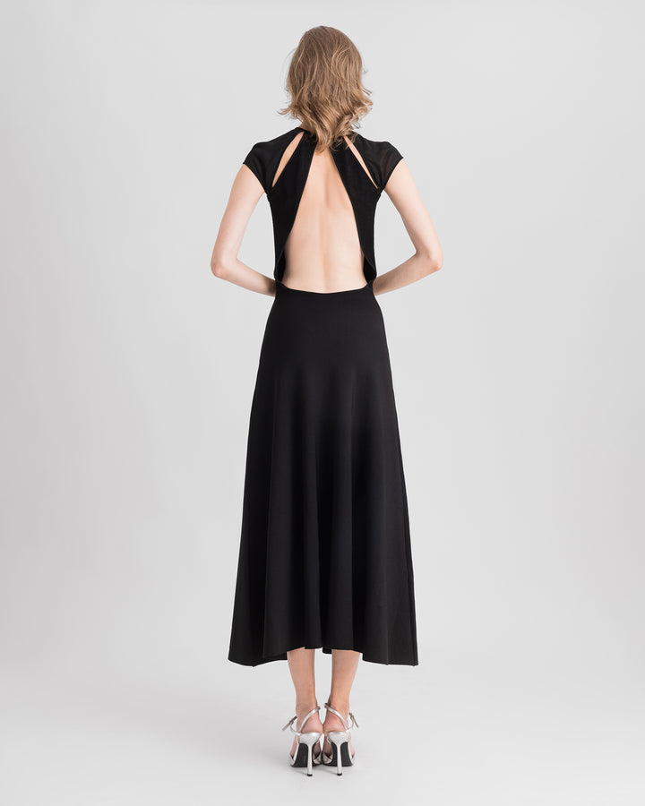 The back of a black flared midi knit dress featuring cut-outs on the shoulders and a open back.