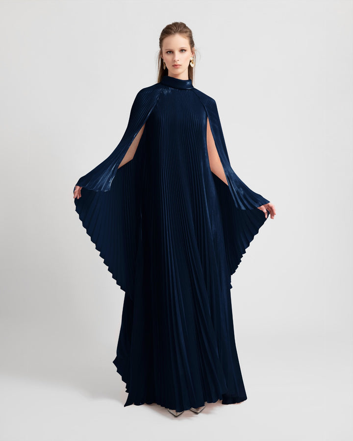 A high neckline fully pleated flared navy organza dress with cape-like sleeves.