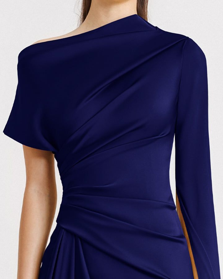 A close-up of an asymmetrical neckline draped evening dress in navy blue satin fabric with a floor-length sleeve.