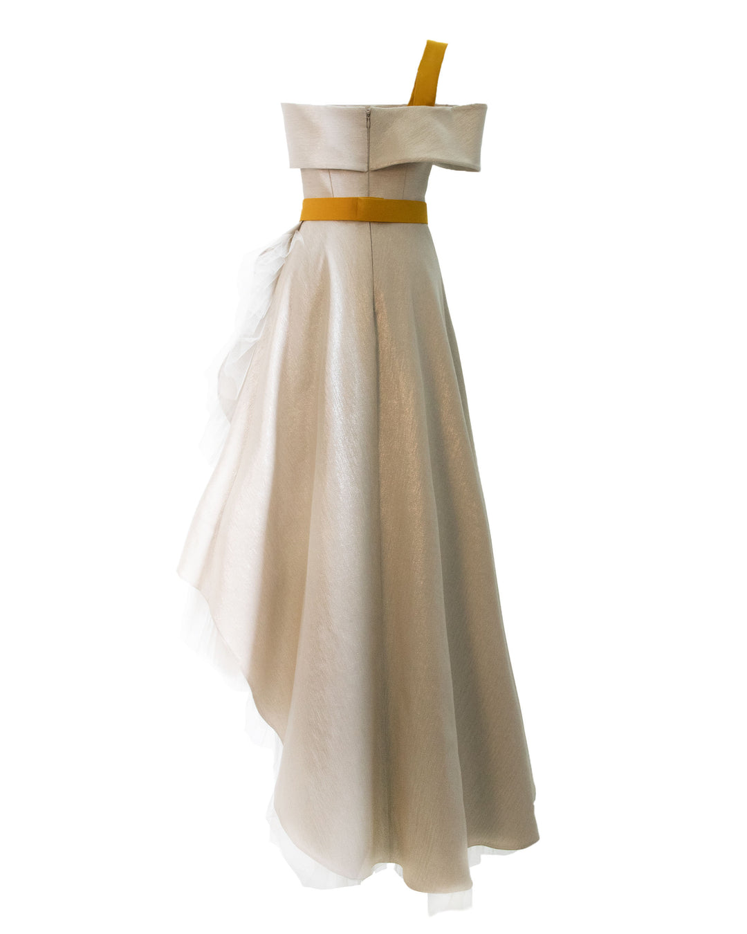 The back of an off-shoulders cut short dress with ruffled tulle underlaying the asymmetrical hemline details in a laminated mikado fabric and a detachable yellow crepe belt and strap.