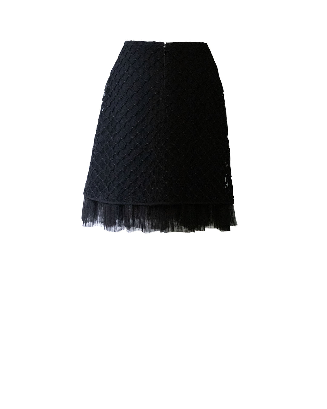 The back of a straight cut, embroidered fishnet short black skirt with ruffled details.