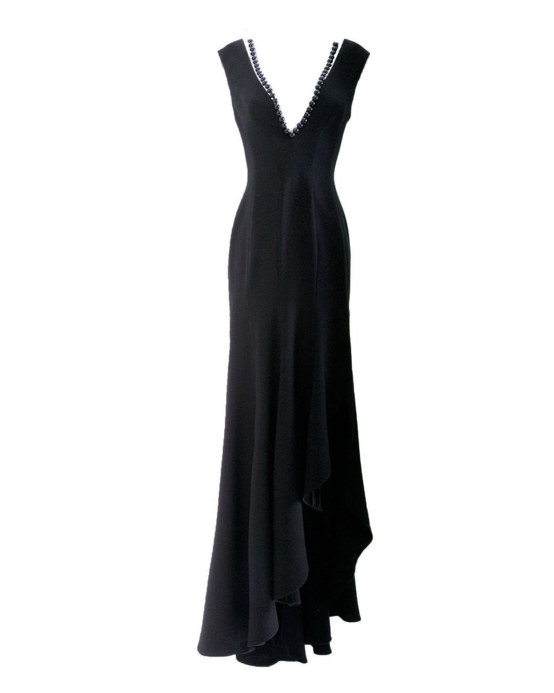 A deep V-neckline, crepe fabric slim cut black evening dress with an asymmetrical ruffled hemline.