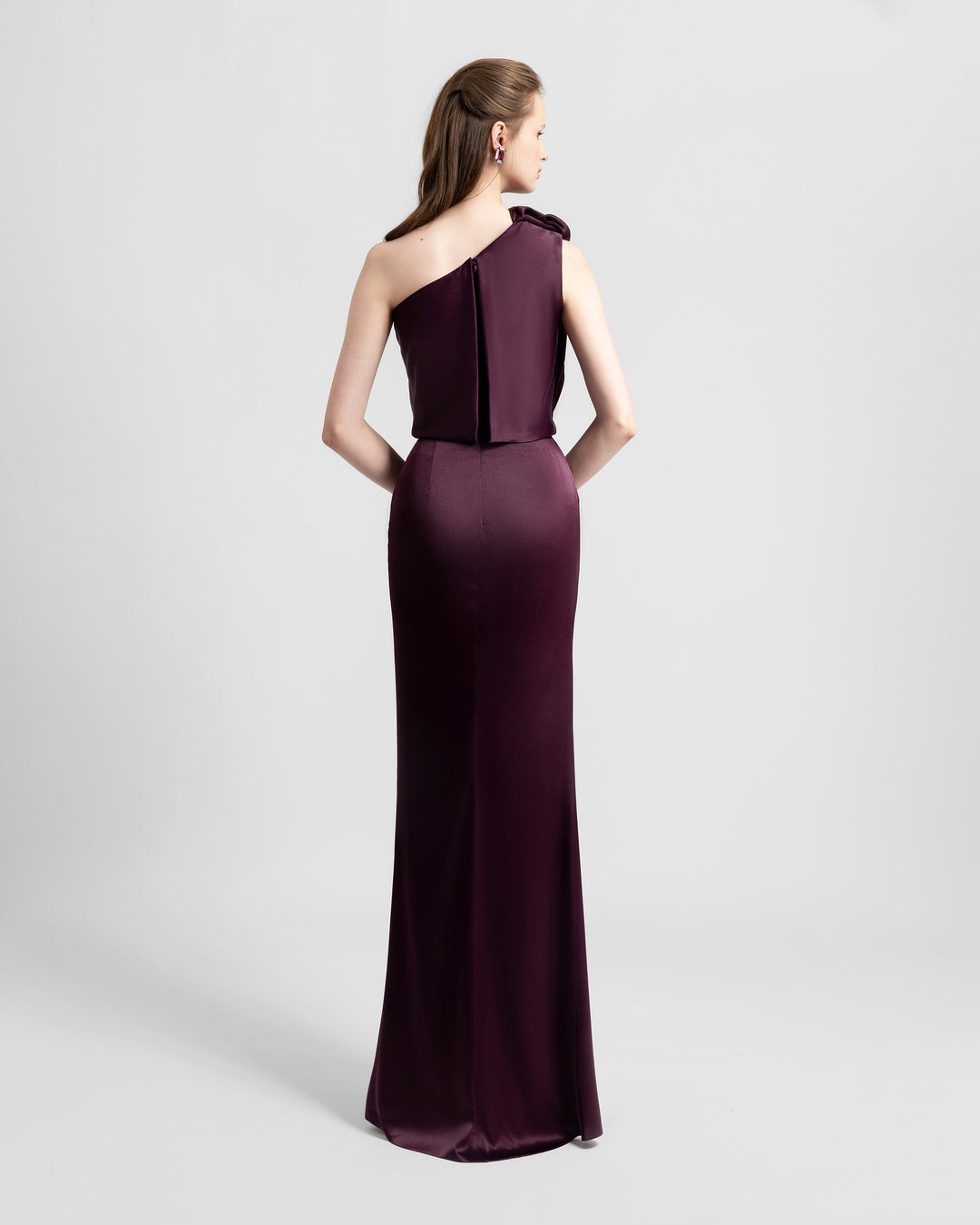 The back of a one-shoulder satin evening dress.