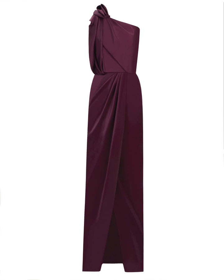 A one-shoulder satin dress with draping details and open slit in the middle.