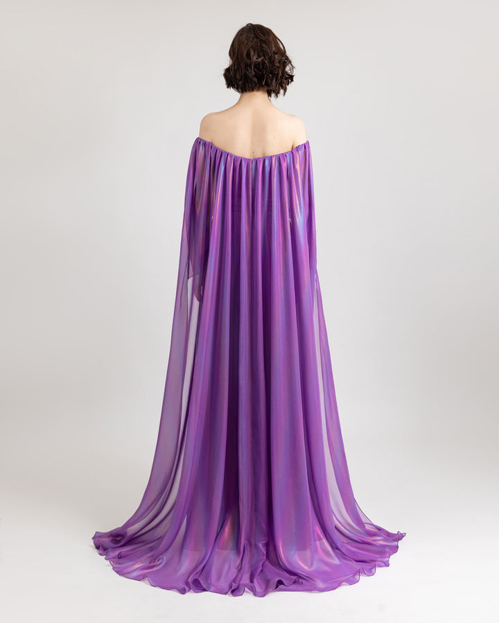 The back of an off-shoulders cape like sleeves, flared cut purple evening dress.