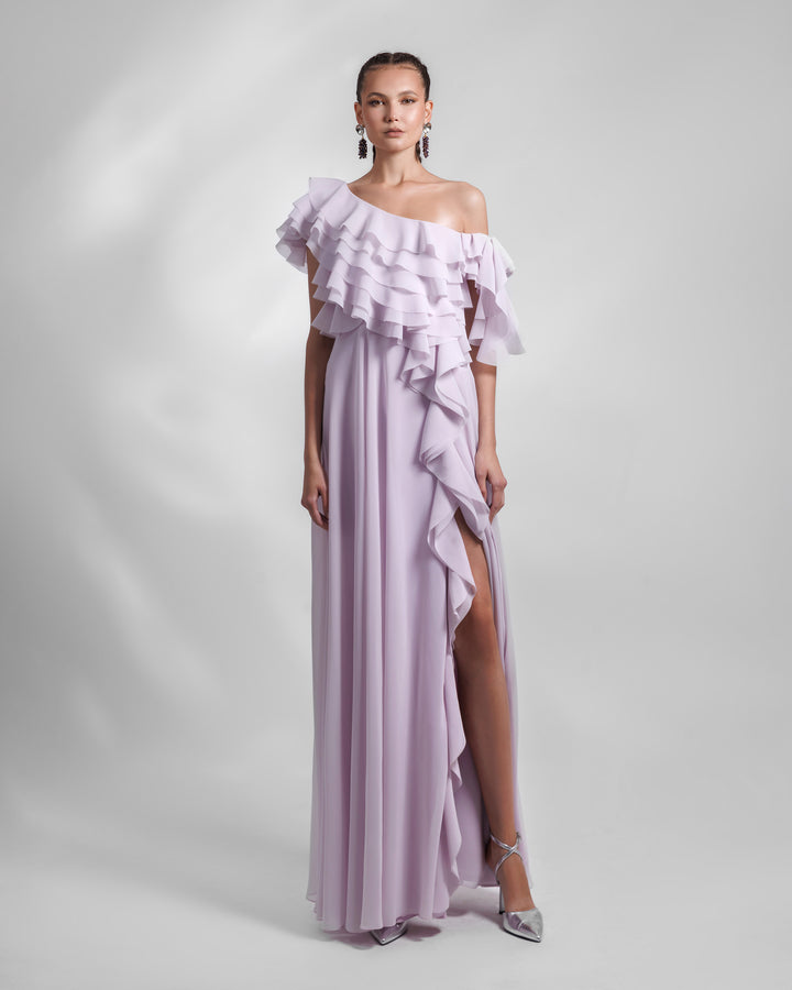 A one-shoulder lilac chiffon evening dress with ruffled bodice details and an open slit on the side.