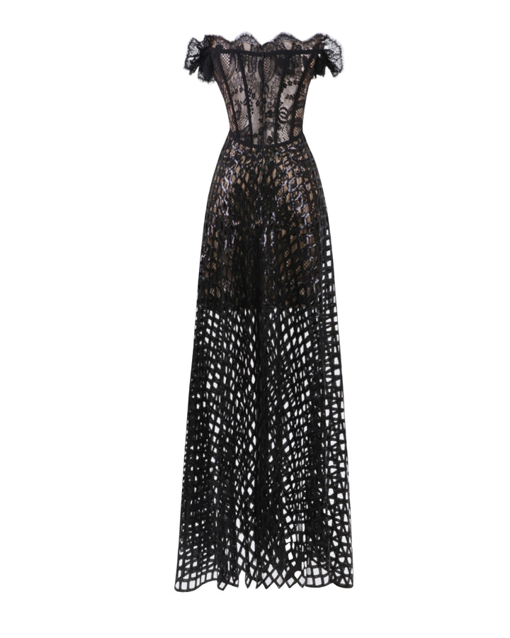 The back of an off-shoulder sequins flared black dress with see-through details.