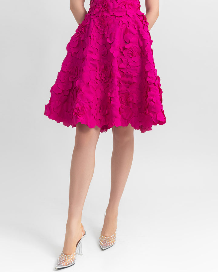 A laser cut short A-line fuchsia skirt.